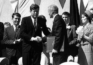 John Glenn being congratulated by President John Kennedy on his return 