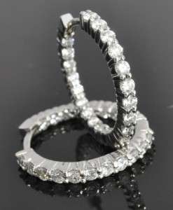   timeless pair of diamond hoop earrings set in solid 14k white gold