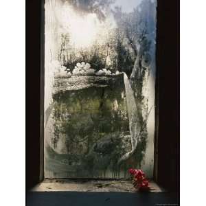 Condensation Surrounds Images Etched into the Glass Windows of the 